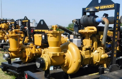 Several Sage Rental Pumps sitting outside on trailers