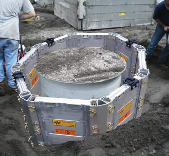 workers using an aluminum octagon build-a-box outside